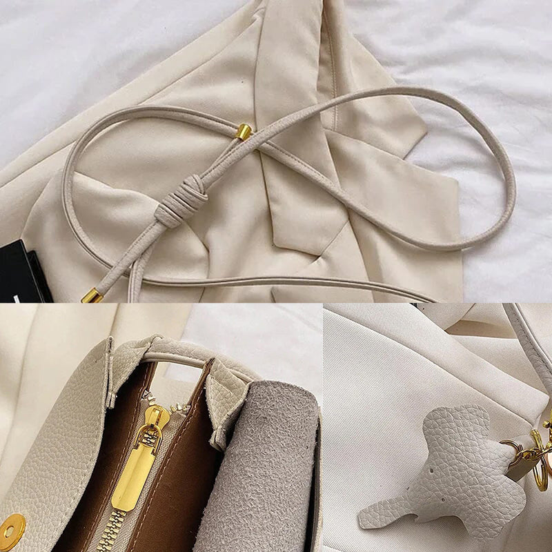 Stilfuld crossbody-taske med elefantvedhæng