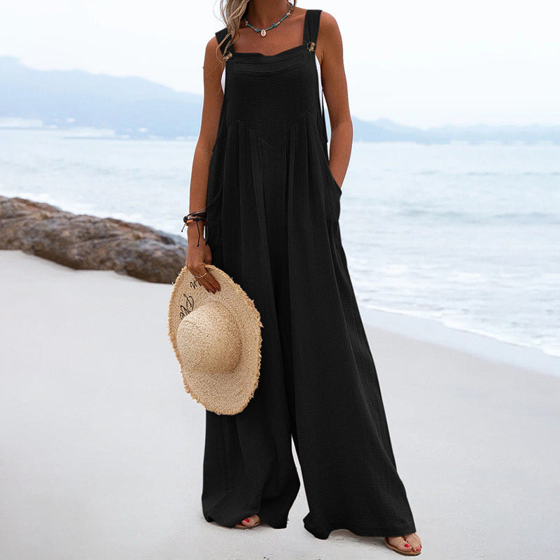 Ensfarvet jumpsuit med brede ben og knapper
