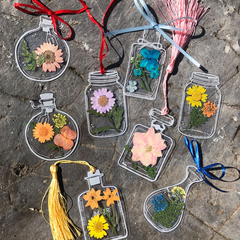 Gennemsigtige tørrede blomster bogmærker