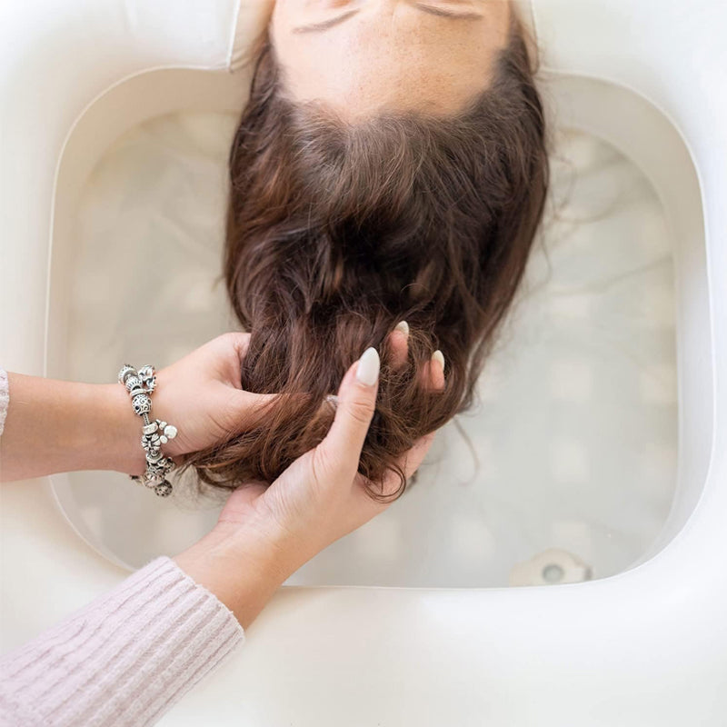 Inflatable shampoo basin with built-in pillow