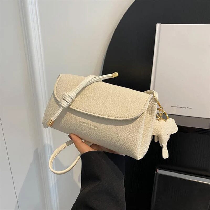 Stilfuld crossbody-taske med elefantvedhæng